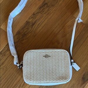 Brand New Coach crossbody purse with adjustable strap.